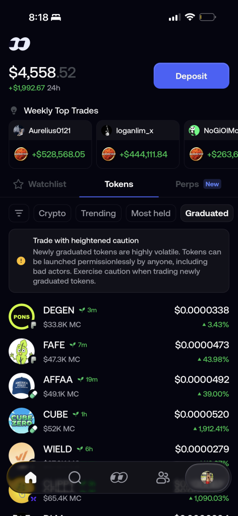 fomo's Graduated tab showing minutes-old tokens with a caution warning